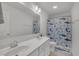 Cheerful bathroom with double sinks, a shark-themed shower curtain and decor that is ideal for children at 1410 Arena Ln, Fuquay Varina, NC 27526
