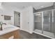 Bathroom with glass shower and double sinks at 1410 Arena Ln, Fuquay Varina, NC 27526