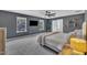Bedroom featuring natural light, ceiling fan, and gray walls, creating a cozy atmosphere at 1410 Arena Ln, Fuquay Varina, NC 27526