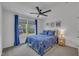 Comfortable bedroom with a ceiling fan, carpet flooring, and bright windows, providing a relaxing retreat at 1410 Arena Ln, Fuquay Varina, NC 27526