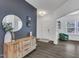 Home Foyer featuring gray accent wall with wood toned credenza and round mirror at 1410 Arena Ln, Fuquay Varina, NC 27526