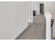 Hallway with gray carpet and white walls leading to living space at 1410 Arena Ln, Fuquay Varina, NC 27526