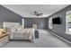 Spacious main bedroom with comfortable bed and a ceiling fan at 1410 Arena Ln, Fuquay Varina, NC 27526