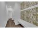 Mudroom features coat hooks, bench and cactus-themed wallpaper at 1410 Arena Ln, Fuquay Varina, NC 27526