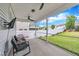Cozy screened patio with furniture, ceiling fan, and view of the well maintained backyard at 1410 Arena Ln, Fuquay Varina, NC 27526