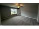 Relaxing bedroom with plush carpeting and a large window offering ample natural light at 146 Starry Sky Dr, Benson, NC 27504