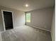 Comfortable carpeted bedroom with bright natural light and access to the spacious closet at 146 Starry Sky Dr, Benson, NC 27504