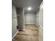Spacious walk-in closet with shelving and durable, light-colored wood floors at 146 Starry Sky Dr, Benson, NC 27504