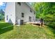 Two-story home featuring a back deck with gray vinyl siding and a well-maintained lawn at 15 White Spruce Ct, Durham, NC 27703