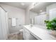 Bright bathroom featuring a marble countertop vanity and neutral paint at 15 White Spruce Ct, Durham, NC 27703