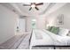 Neutral bedroom showcasing a comfortable bed, patterned rug, and doorway to an adjacent laundry and bath at 15 White Spruce Ct, Durham, NC 27703