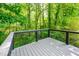 Secluded deck overlooking a serene wooded area, offering privacy and tranquility at 15 White Spruce Ct, Durham, NC 27703