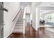 Inviting foyer features hardwood floors, staircase, and views of the dining and living areas at 15 White Spruce Ct, Durham, NC 27703
