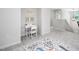Hallway with carpet, a desk, and a stairwell to the lower level at 15 White Spruce Ct, Durham, NC 27703