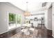 Open concept kitchen with island, stainless steel appliances, and dining area leading to the deck at 15 White Spruce Ct, Durham, NC 27703
