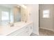 Bright bathroom features double sinks, white cabinets, and a large mirror at 16 Decatur Dr, Fuquay Varina, NC 27526