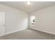 Clean bedroom features neutral carpet, trim, paint and a window at 16 Decatur Dr, Fuquay Varina, NC 27526