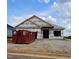 A house is under construction with a dumpster outside and homeGUARD housewrap at 16 Decatur Dr, Fuquay Varina, NC 27526