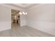 Elegant dining area featuring stylish trim, modern lighting, and laminate floors at 16 Decatur Dr, Fuquay Varina, NC 27526