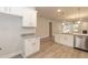 Modern kitchen with white cabinets, granite countertops, and stainless steel appliances at 16 Decatur Dr, Fuquay Varina, NC 27526