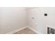 Clean laundry room includes tile flooring and washing machine hookups at 16 Decatur Dr, Fuquay Varina, NC 27526