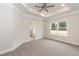 Large main bedroom features tray ceilings, carpet, bright window and access to main bathroom at 16 Decatur Dr, Fuquay Varina, NC 27526