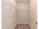 Large walk-in closet with carpeted flooring and hanging shelves at 16 Decatur Dr, Fuquay Varina, NC 27526