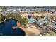 An aerial view features the community pool, clubhouse, playground, pond, and the neighborhood surrounding it at 1820 Grassy Falls Ln, Wendell, NC 27591
