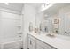 Bathroom with a shower-tub combo, a large mirror, and a spacious vanity with sink at 1820 Grassy Falls Ln, Wendell, NC 27591