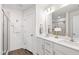 Bathroom with double sink vanity, dark wood floors, and modern fixtures at 1820 Grassy Falls Ln, Wendell, NC 27591