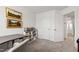 Bright bedroom featuring a desk and shelving, bathed in natural light at 1820 Grassy Falls Ln, Wendell, NC 27591