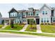 Beautiful multi-story townhomes with colorful exteriors and well-kept landscaping at 1820 Grassy Falls Ln, Wendell, NC 27591