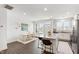 Well-lit kitchen with granite island, dining area, and open layout, perfect for cooking and entertaining guests at 1820 Grassy Falls Ln, Wendell, NC 27591