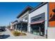 Modern retail stores with stylish storefronts and awnings, offering a variety of shopping and dining options at 1820 Grassy Falls Ln, Wendell, NC 27591