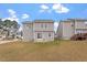 Backyard view highlighting the home's patio, lawn, and siding at 197 Scranton Ct, Cameron, NC 28326