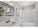 Bright bathroom features a shower and tub combo and decorative art pieces at 197 Scranton Ct, Cameron, NC 28326