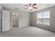 Spacious bedroom with ceiling fan, carpet, and window, creating a comfortable atmosphere at 197 Scranton Ct, Cameron, NC 28326