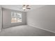Bright bedroom features neutral carpet, paint, and a large window at 197 Scranton Ct, Cameron, NC 28326