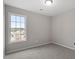 Bedroom showcasing a window with views of the neighborhood at 197 Scranton Ct, Cameron, NC 28326