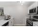 Well-lit kitchen with stainless steel appliances, white cabinets, and modern tile backsplash at 197 Scranton Ct, Cameron, NC 28326