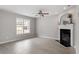 Bright living room with large windows and a decorative fireplace at 197 Scranton Ct, Cameron, NC 28326