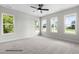 Spacious bedroom with large windows providing natural light and ceiling fan at 200 Pretty Run Branch Ln, Wendell, NC 27591