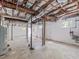 Unfinished basement featuring exposed ducts, utilities, and a walkout door at 203 Wood Cir, Chapel Hill, NC 27514