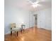 Bedroom boasts hardwood floors, neutral walls, with an adjoining hallway and closet at 203 Wood Cir, Chapel Hill, NC 27514