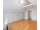 Cozy bedroom with hardwood floors, built-ins and doorway to an adjacent room at 203 Wood Cir, Chapel Hill, NC 27514