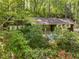 Charming single-story home with brick accents, white shutters, and a beautifully landscaped front yard at 203 Wood Cir, Chapel Hill, NC 27514