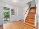 Entryway featuring a hardwood floor and a staircase leading to the second floor at 203 Wood Cir, Chapel Hill, NC 27514
