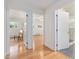Hallway shows hardwood floors, access to the bedroom, and bathroom with stylish, glass enclosed shower at 203 Wood Cir, Chapel Hill, NC 27514
