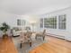 Bright living room showcasing hardwood floors, neutral paint, and large windows at 203 Wood Cir, Chapel Hill, NC 27514