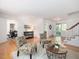 Spacious living room with hardwood floors that transition seamlessly to an adjacent dining space at 203 Wood Cir, Chapel Hill, NC 27514